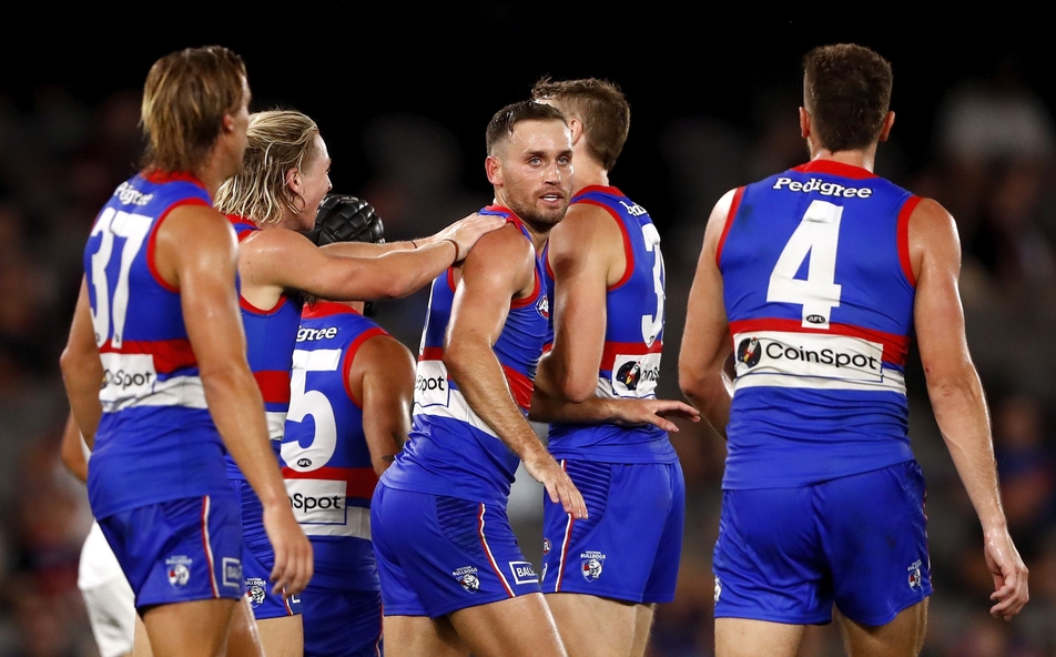 Hayden Crozier celebrates a goal with teammates during the AAMI Community Series clash between the Western Bulldogs and Brisbane at Marvel Stadium on March 4, 2022. Picture: AFL Photos